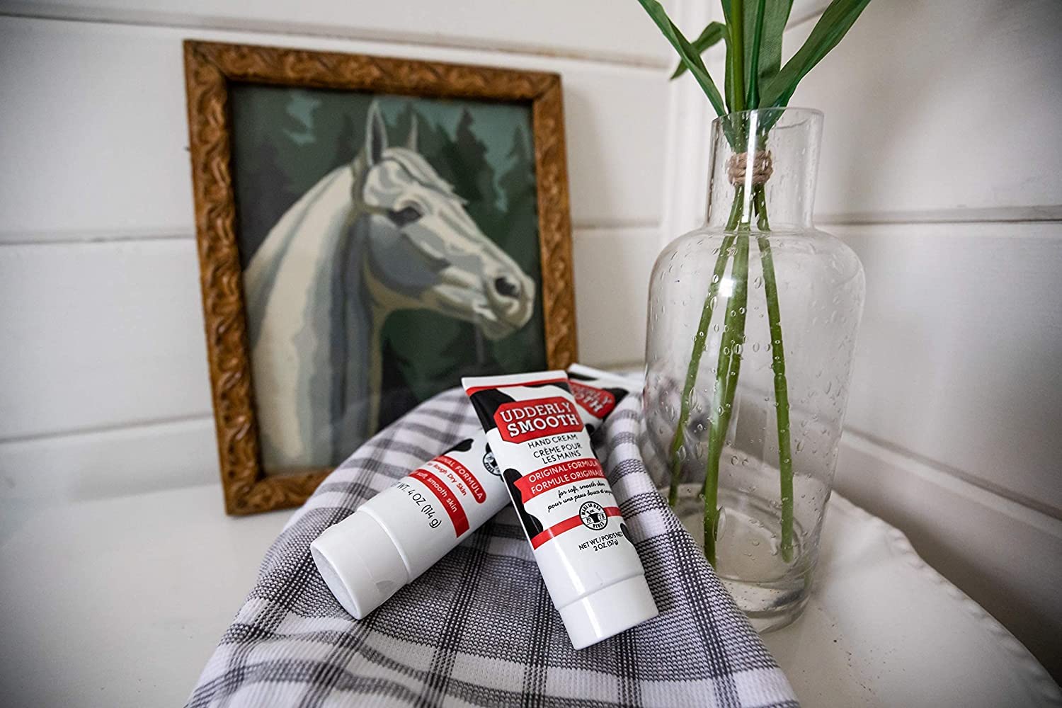 Udderly Smooth label close-up highlighting non-greasy, fast-absorbing formula