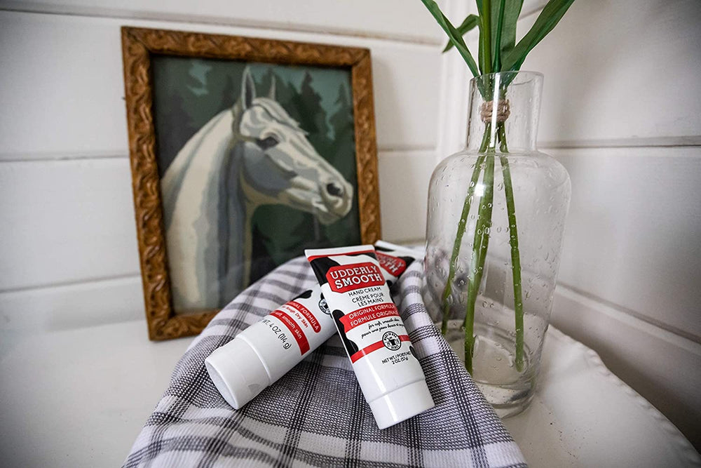 Udderly Smooth label close-up highlighting non-greasy, fast-absorbing formula