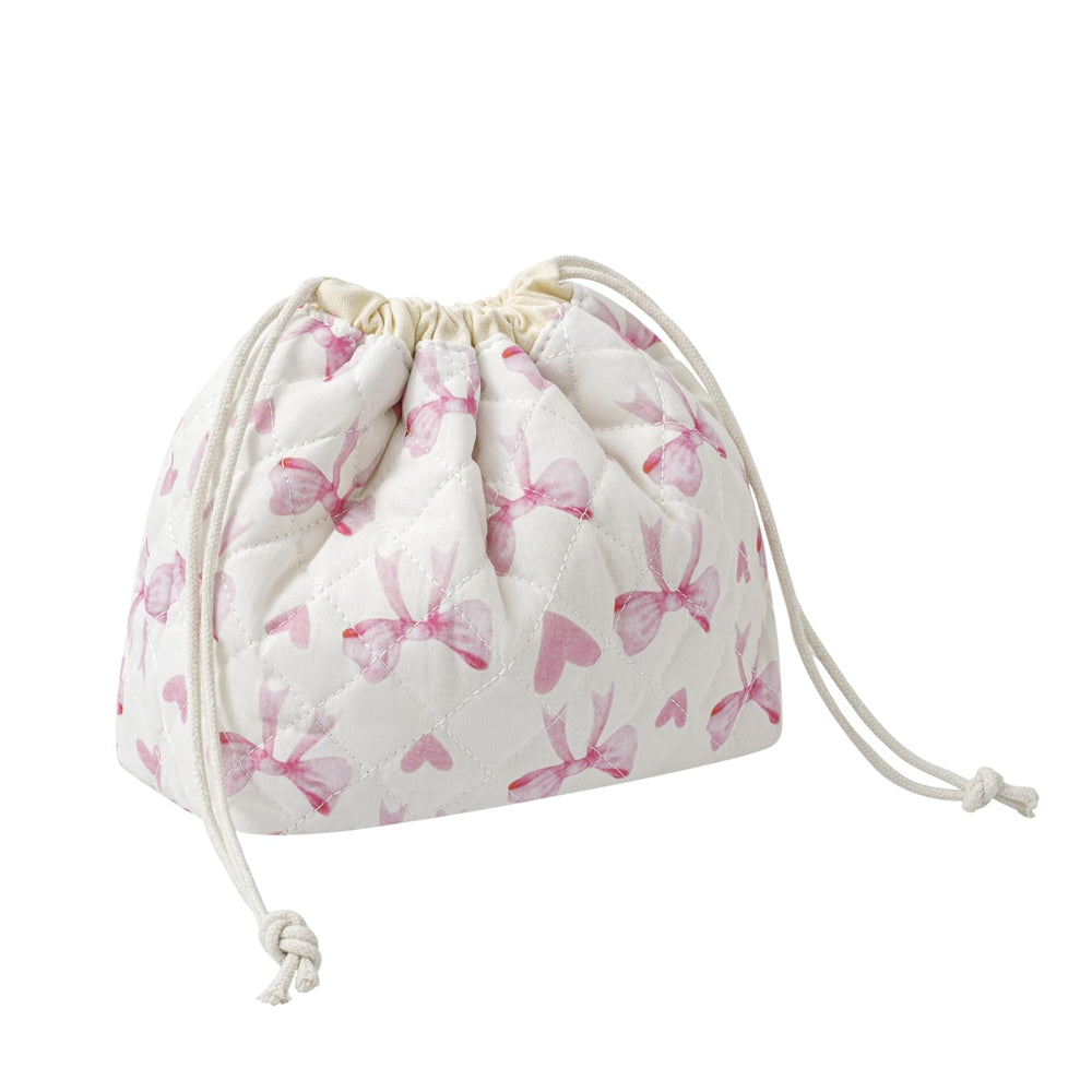 uekeboag cotton quilted makeup bag close-up shows soft fabric and floral stitching for daily cosmetics.