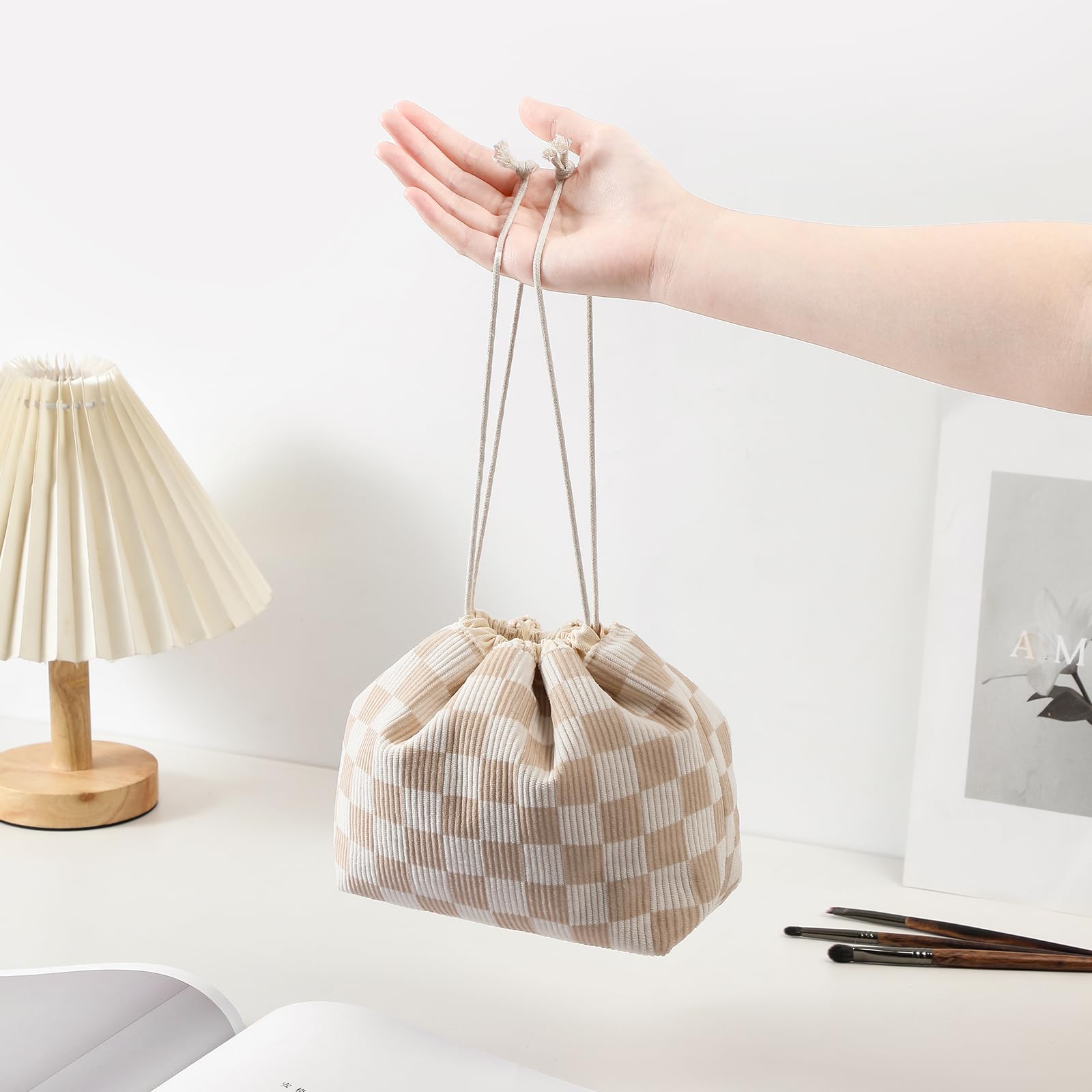 uekeboag drawstring makeup bag easy-access opening emphasizes quick item retrieval on busy mornings