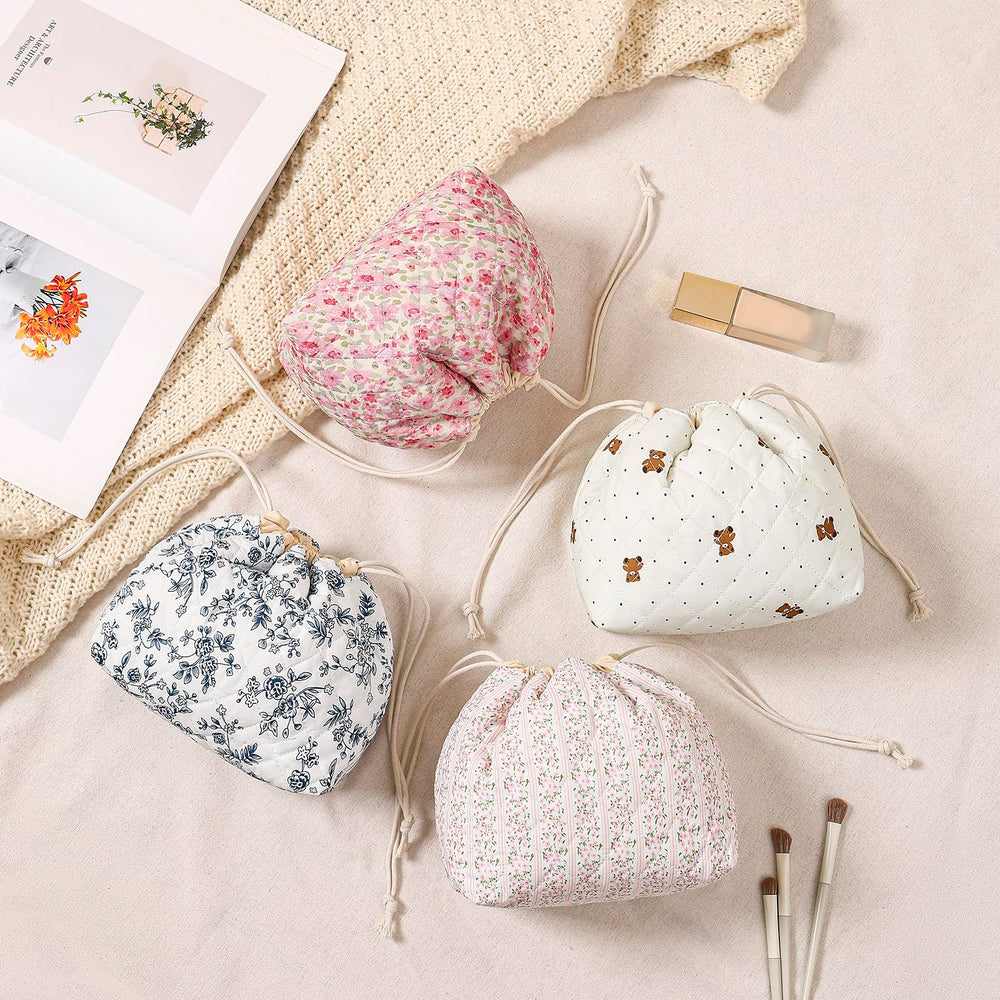 Uekeboag makeup bag open with drawstring closure enables quick access while traveling.