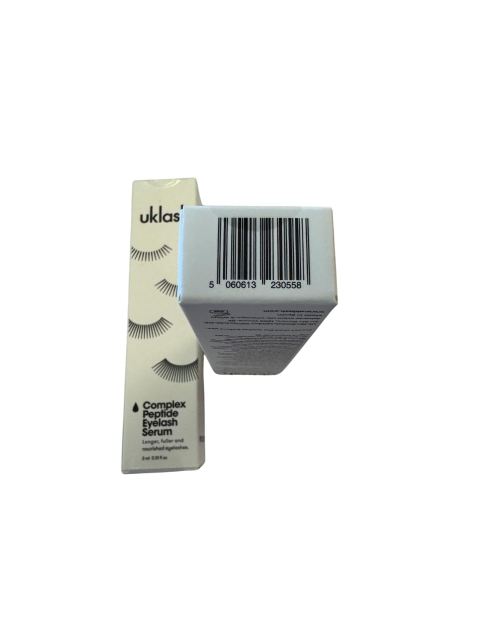 UKLASH product styled with other beauty items, showing polished lifestyle appeal