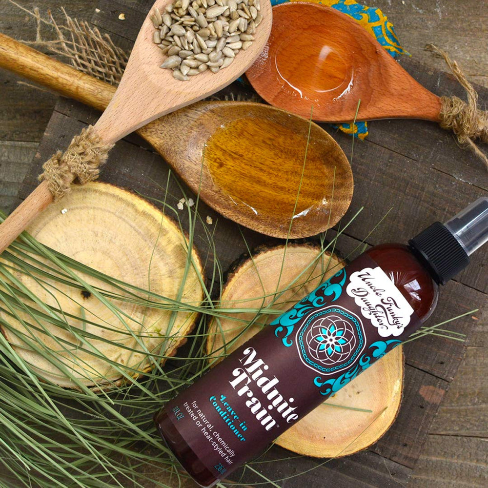 Uncle Funky's Daughter Midnite Train detangling routine reduces knots during styling.