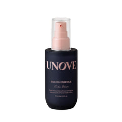 UNOVE Silk Oil Serum bottle closeup demonstrates nourishing protection for damaged hair.