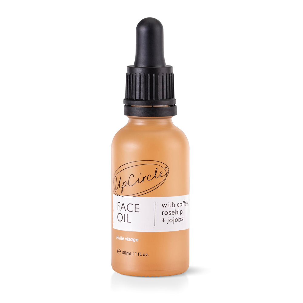 UpCircle coffee oil serum bottle close-up for hydrated skin
