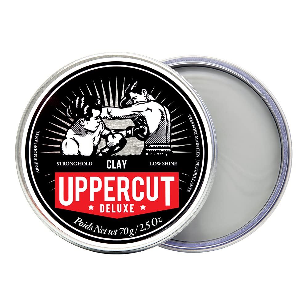 Uppercut Deluxe Clay water-based formula captured mid-application for easy wash-out.
