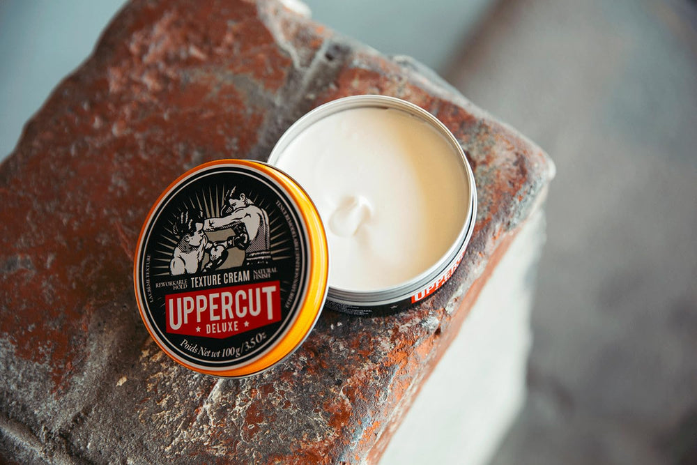 UPPERCUT DELUXE Texture Cream bottle highlights Leather Shadow fragrance.