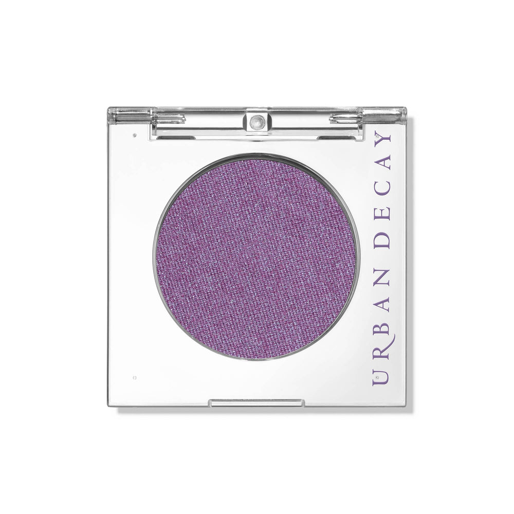 Urban Decay 24/7 Eyeshadow Single Freebird compact shows sheer lilac shimmer for everyday looks.