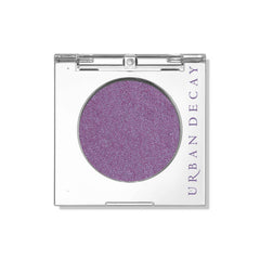 Urban Decay 24/7 Eyeshadow Single Freebird compact shows sheer lilac shimmer for everyday looks.