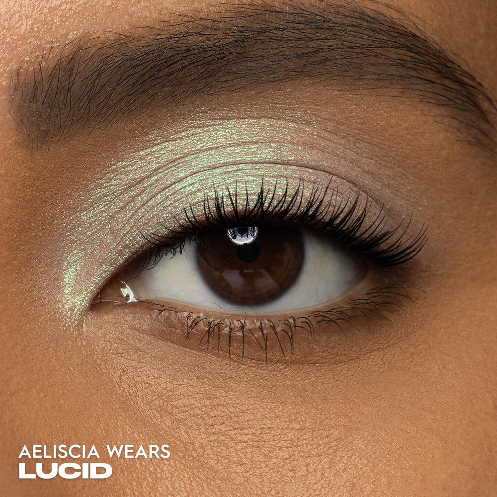 Urban Decay 24/7 Lucid teal swatch on skin demonstrates rich pigment and blendable texture.