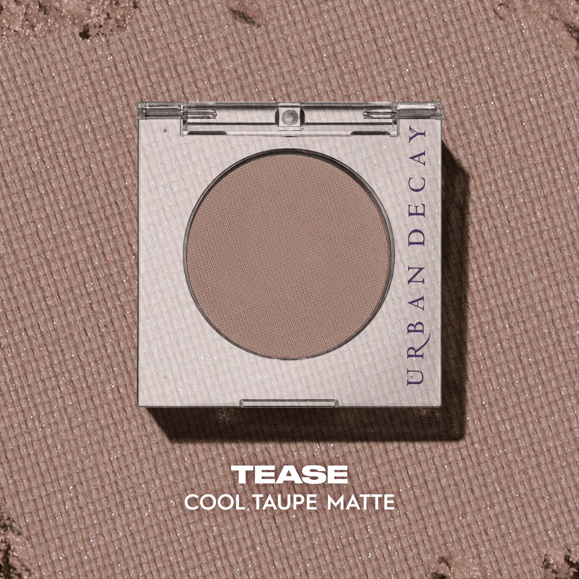 Urban Decay 24/7 Eyeshadow Tease applying with brush shows smooth buildable color.