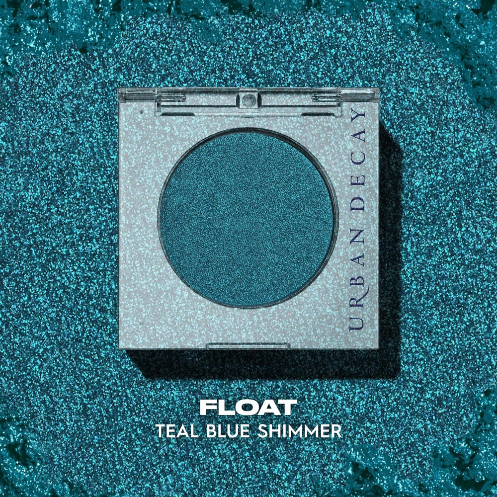 Urban Decay 24/7 Longwear Eyeshadow Single Float teal shimmer closeup highlights creamy, velvety texture.