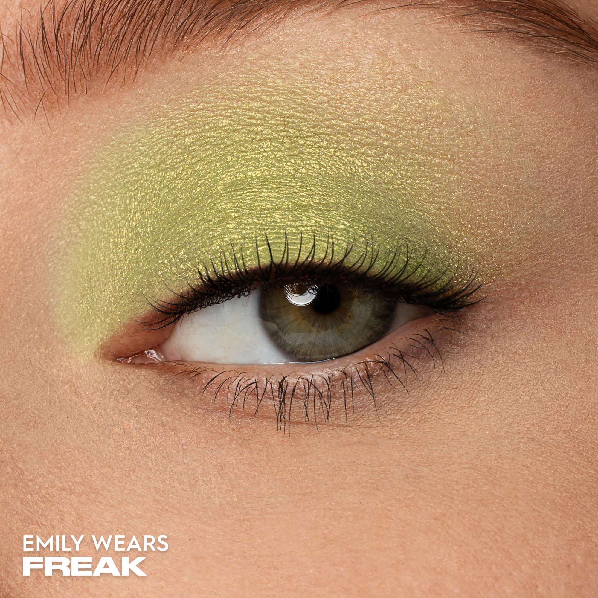 Urban Decay Freak swatch shows long-wearing lime shimmer on the arm