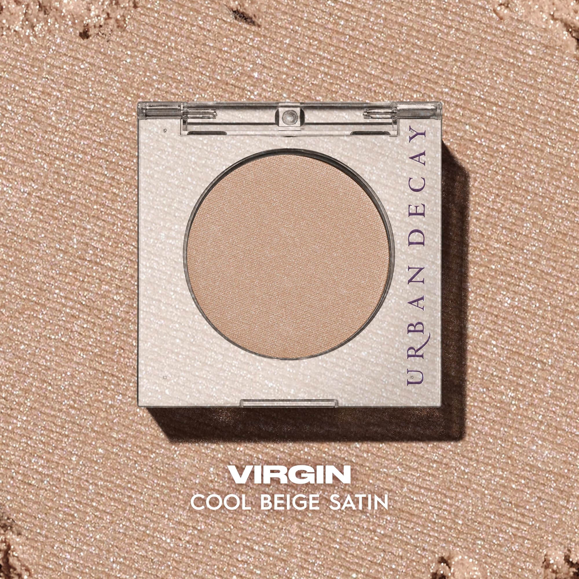 Urban Decay 24/7 Virgin eyeshadow finger application close-up for intense payoff and smooth blend.