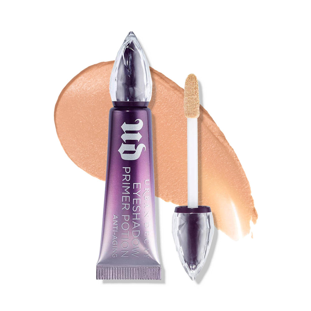 Urban Decay Anti-Aging Eyeshadow Primer Potion Travel Mini nude bottle preps lids for shadow.