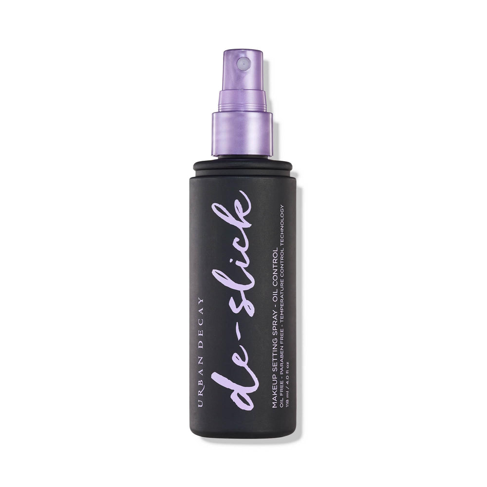 Urban Decay De-Slick bottle front shows oil-control matte setting spray.