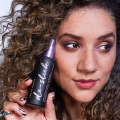 Urban Decay De-Slick mist dispense demonstrates a fine weightless spray.