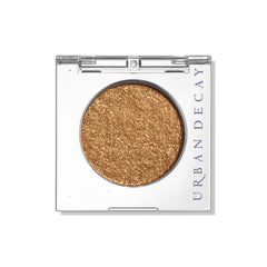 Urban Decay Dumb Luck eyeshadow single compact swatch with rich warm copper color and long-lasting payoff