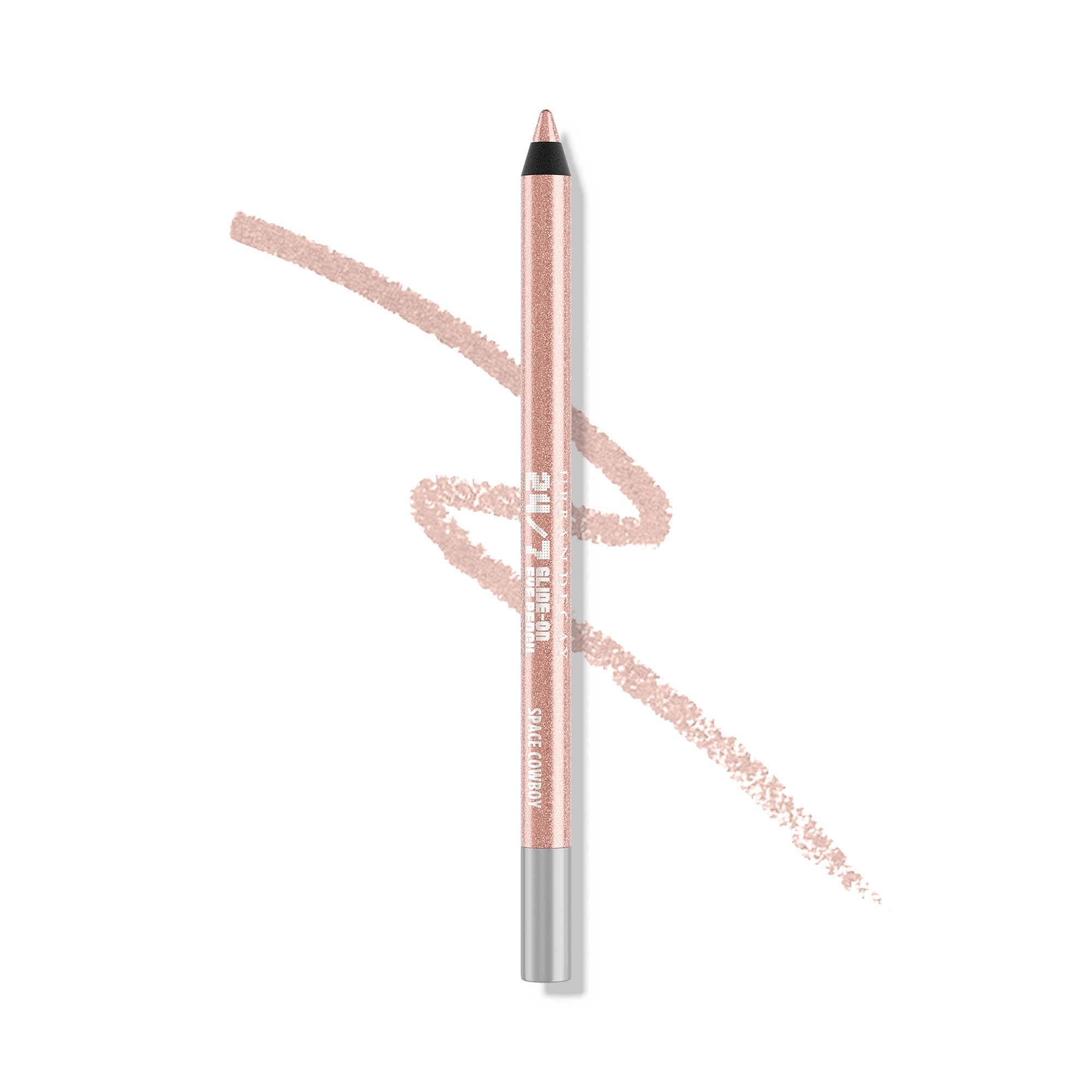 Urban Decay Space Cowboy pencil close-up showing peach shimmer and silver sparkle for soft daytime looks