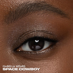 Urban Decay Moondust Space Cowboy compact closeup highlights luxe shimmer.