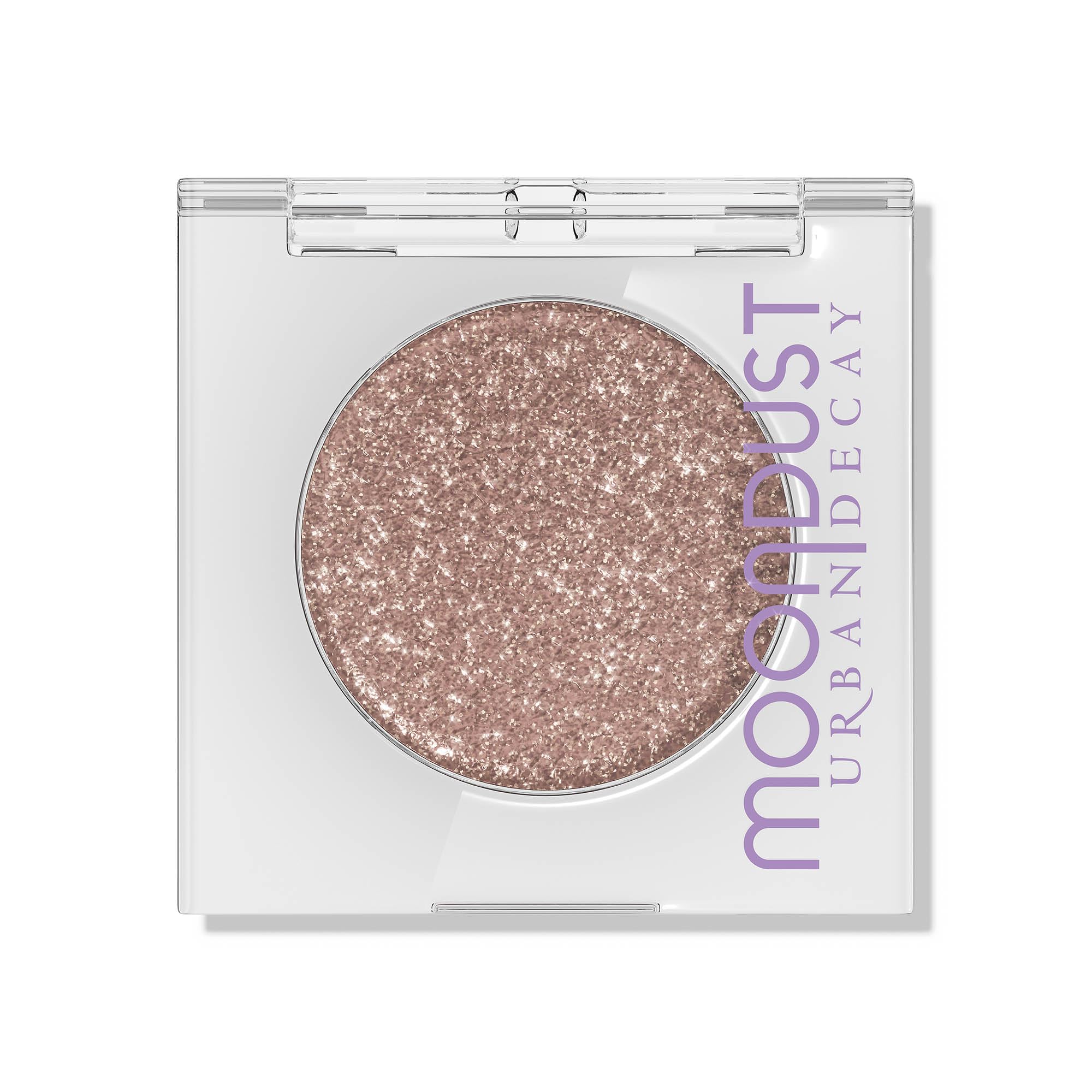 Urban Decay Moondust Space Cowboy swatch on arm reveals champagne-gold sparkle with lasting shine.