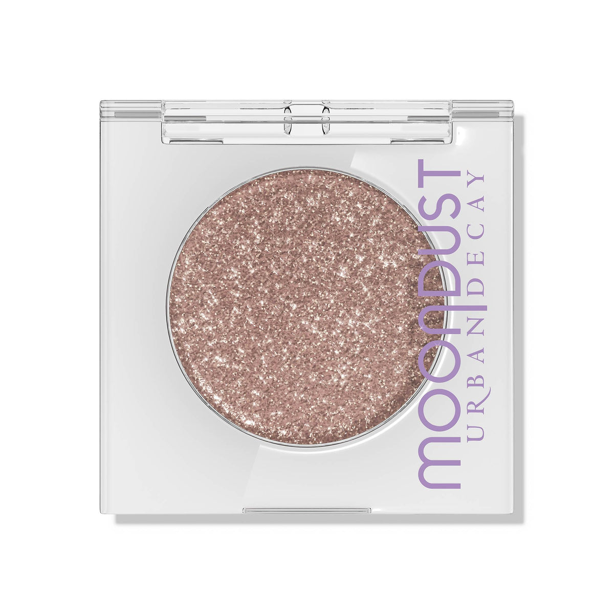 Urban Decay Moondust Space Cowboy swatch on arm reveals champagne-gold sparkle with lasting shine.