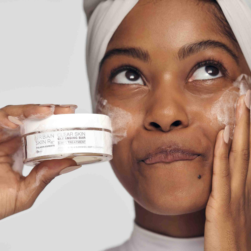 Urban Skin Rx Clear Skin Bar lather in hand demonstrating creamy foam for cleansing.