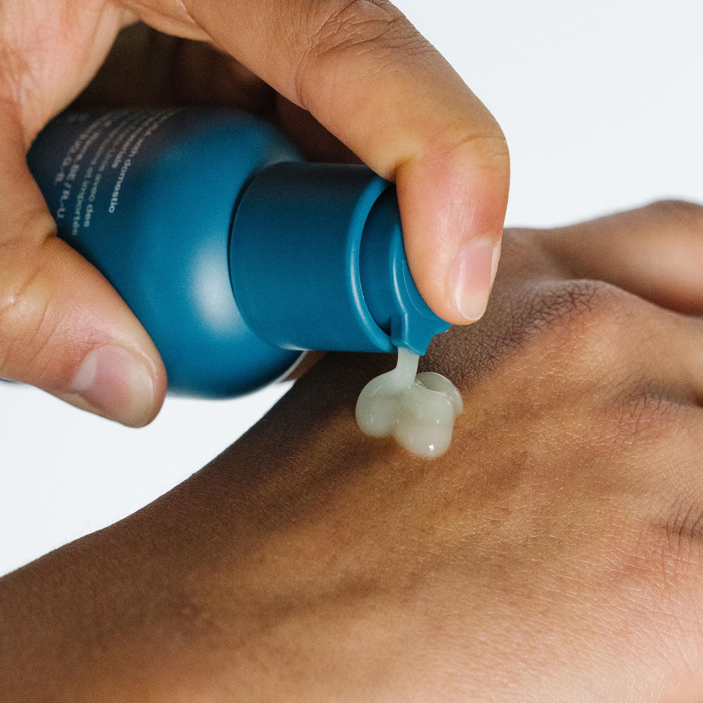 Ursa Major Forest Water Serum being applied for refreshed, plump skin.