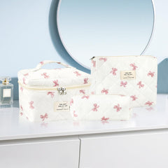 URSKYTOUS side view of quilted cosmetic bag showing compact profile