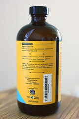 Us Naturals dark amber bottle close-up preserves purity and freshness.