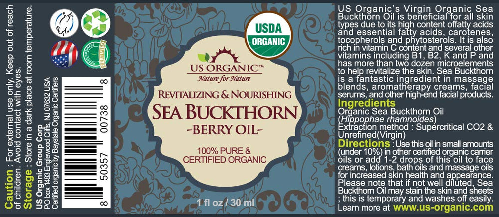 Close-up of US Organic sea buckthorn oil in amber bottle showing vibrant color.