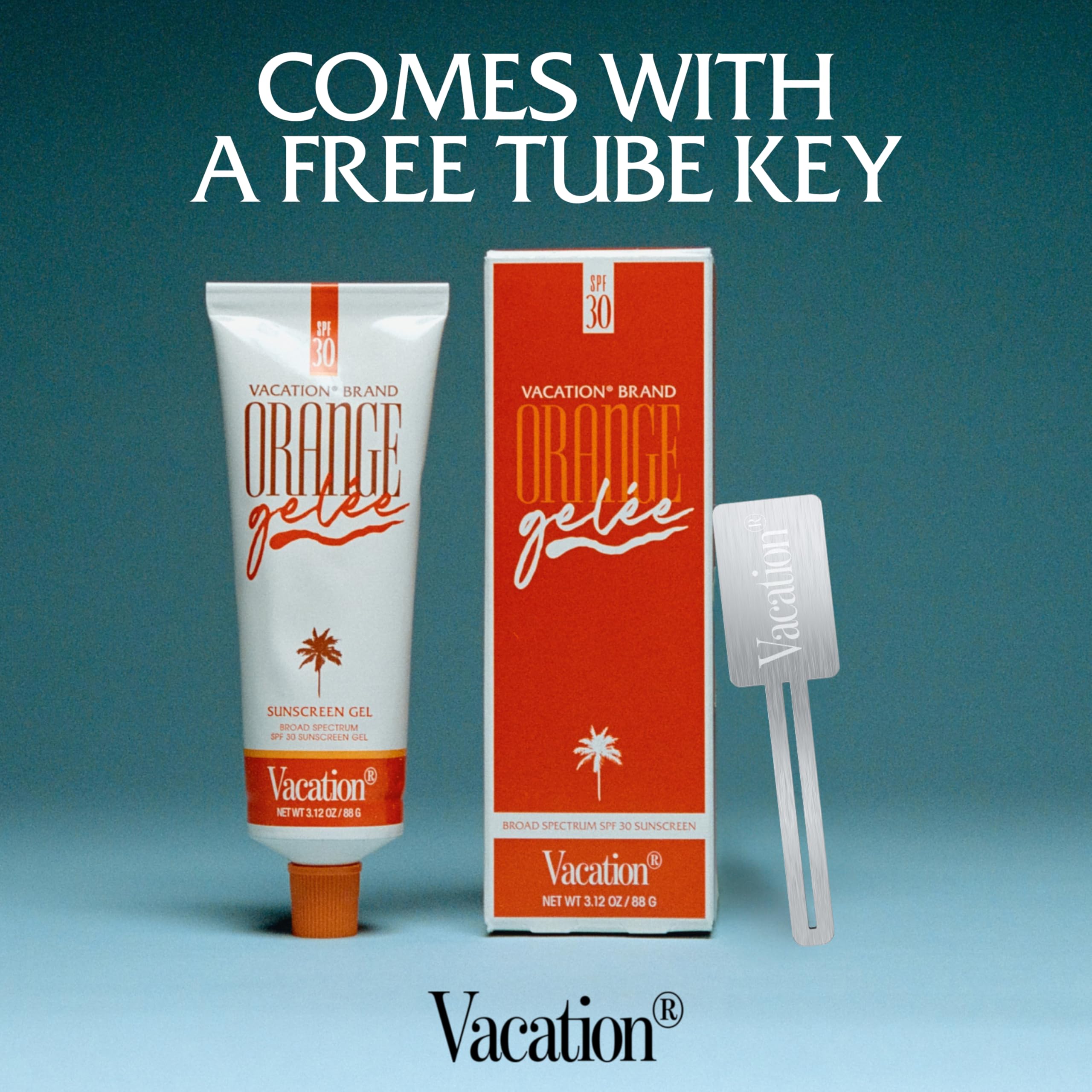 Vacation Orange Gelée travel-size bottle beside key and sunscreen bag for easy trips.