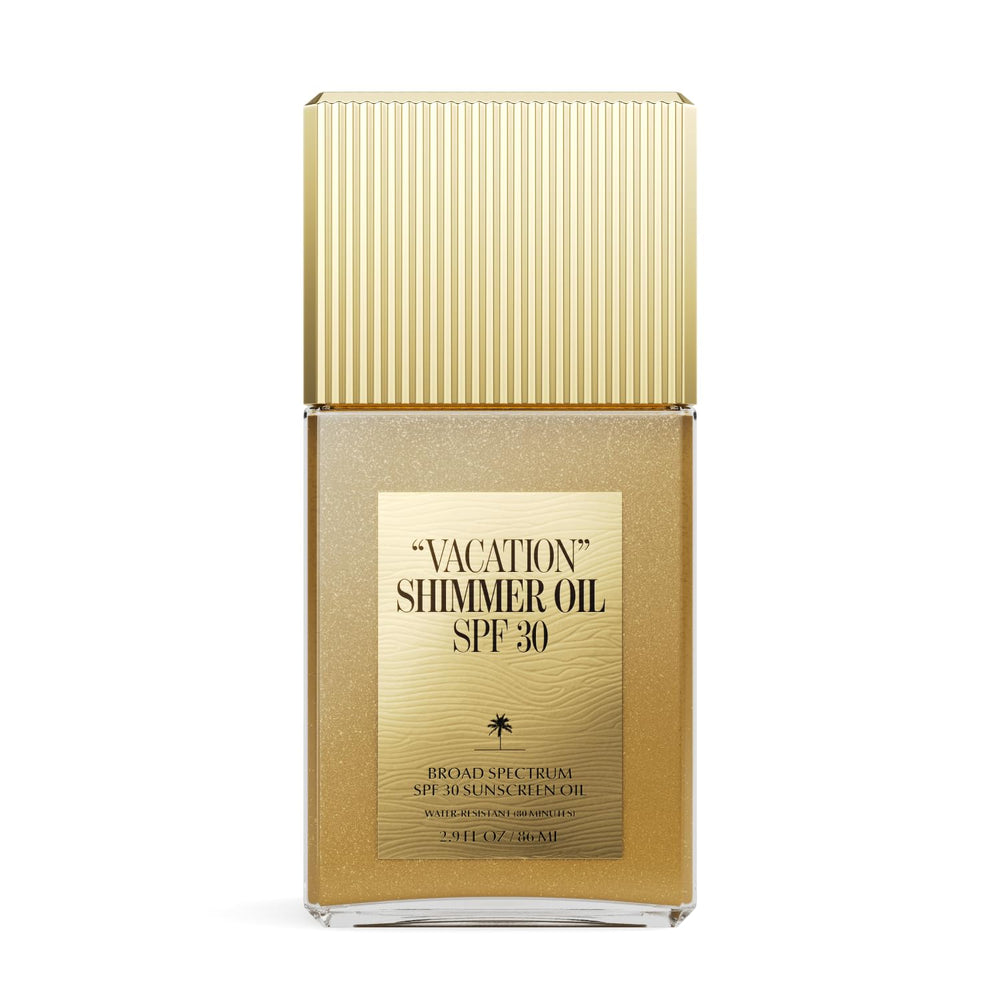 VACATION shimmer oil bottle pour for radiant beach-ready glow