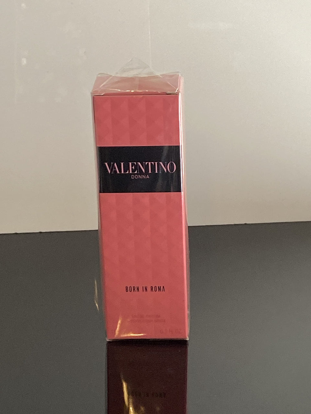 Valentino Donna Born In Roma mood shot emphasizes vanilla and woods warmth.