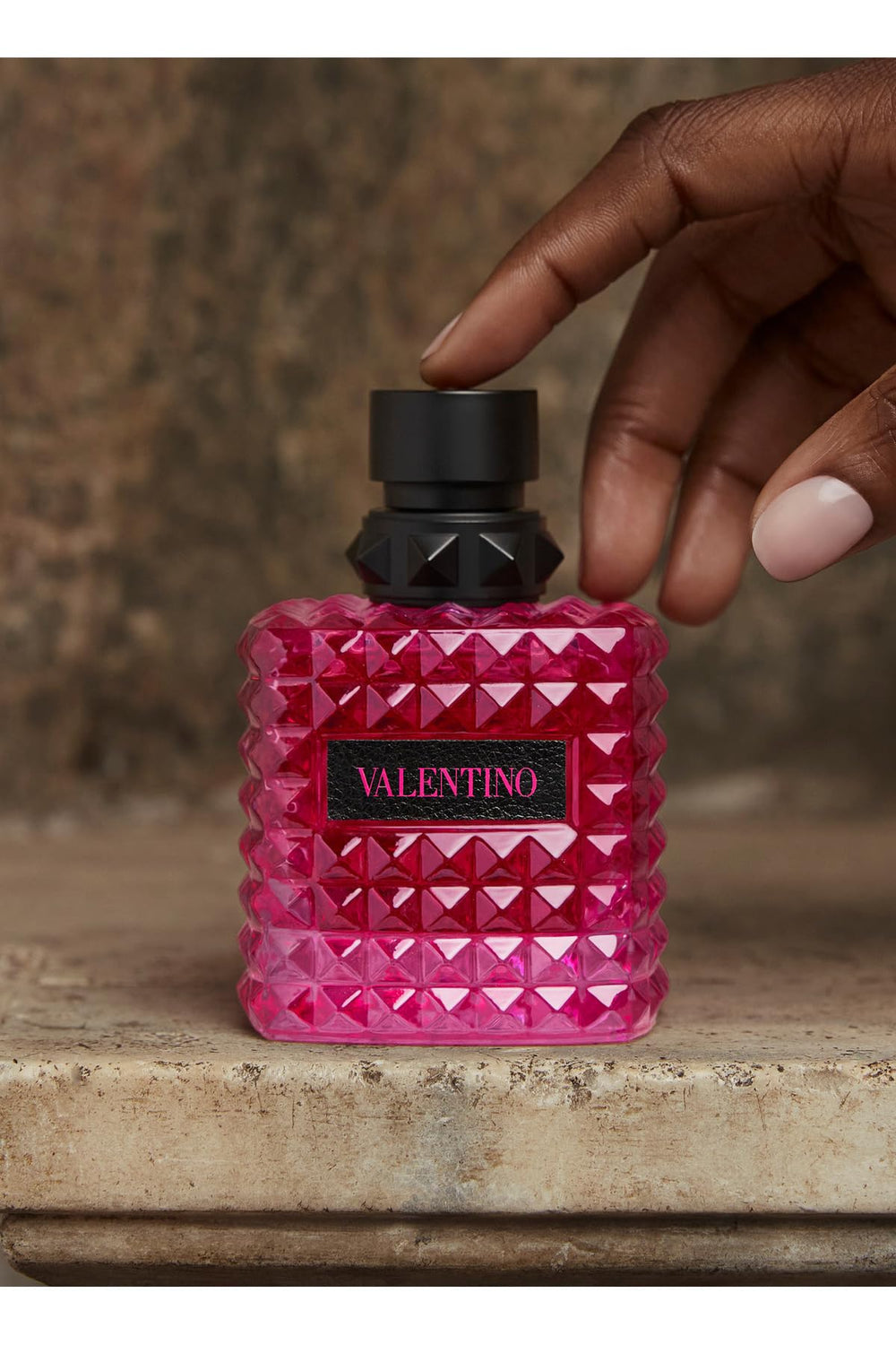 Valentino packaging environment note indicates eco-friendly packaging appealing to eco-conscious shoppers.
