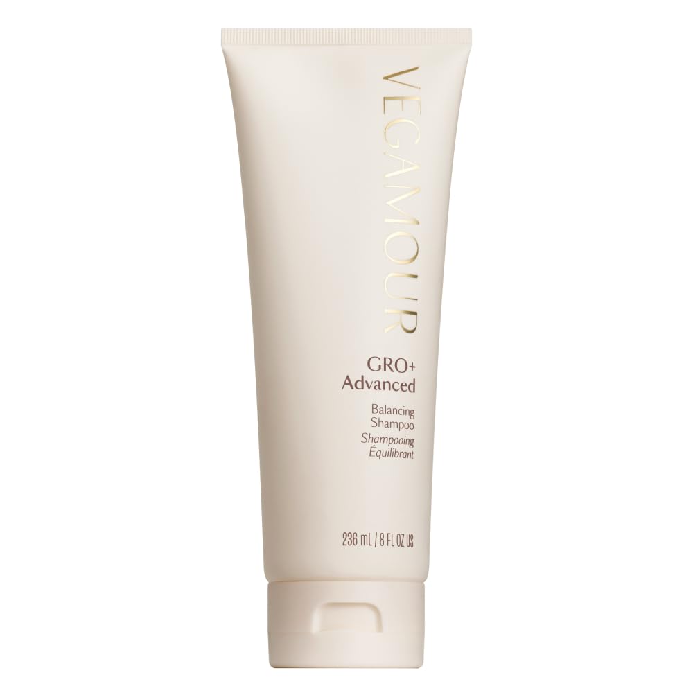 VEGAMOUR GRO+ Advanced Balancing Shampoo bottle on sink delivers gentle cleansing and buildup removal.