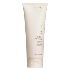 VEGAMOUR GRO+ Advanced Balancing Shampoo bottle on sink delivers gentle cleansing and buildup removal.