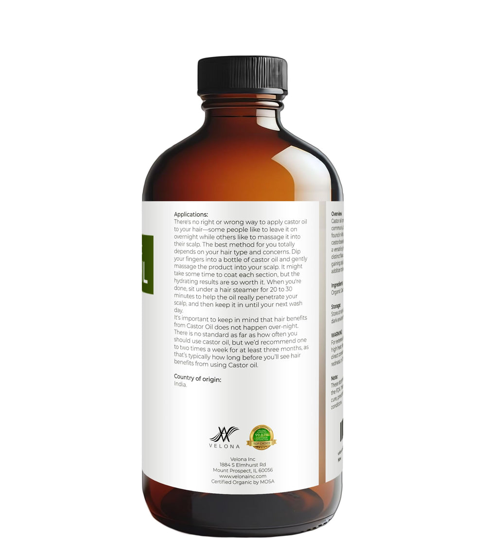Velona castor oil bottle in hand conveys easy, at-home beauty routine.