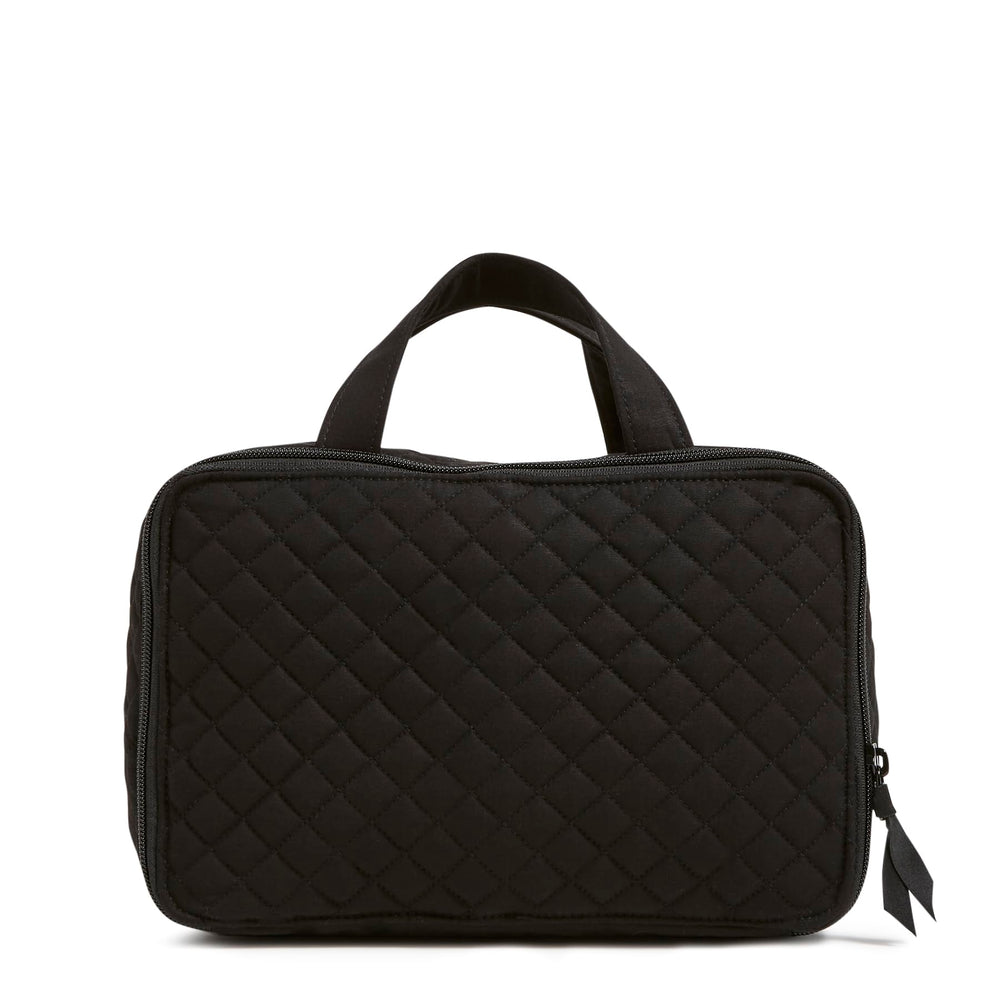 Vera Bradley black travel case back view featuring gusseted pockets and zip pocket.