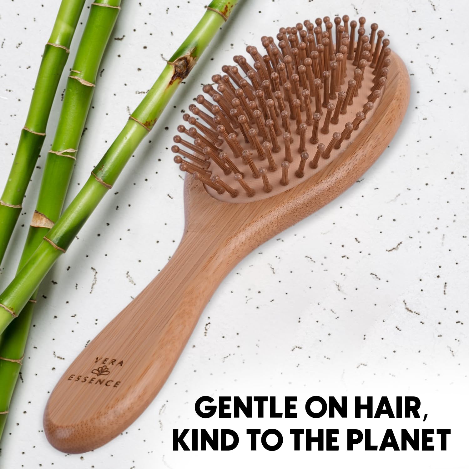 Vera Essence bamboo brush travel-size and compact for on-the-go grooming.