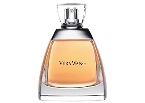 Vera Wang bottle angled beside a dress, suggesting elegant evening wear