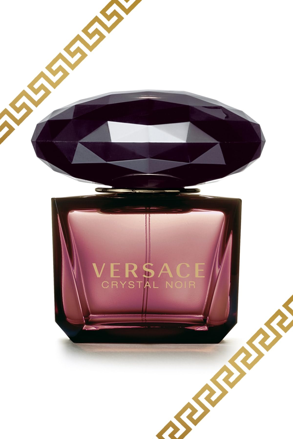 Versace Crystal Noir model spotlight ad suggests glamorous nighttime wear and confidence.