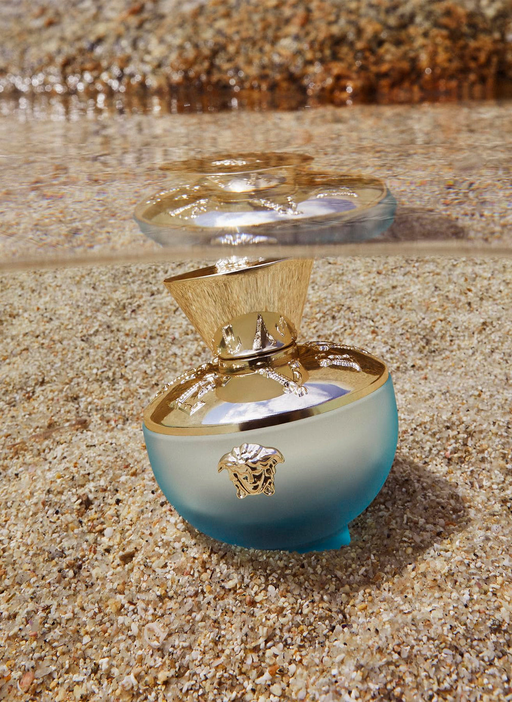 Versace Dylan Turquoise notes close-up hint at citrus freshness and warm cedar.