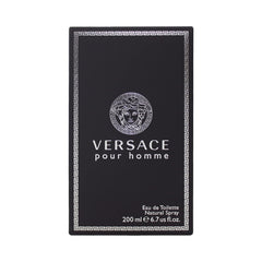 Versace Pour Homme bottle on dresser shows timeless daily elegance.