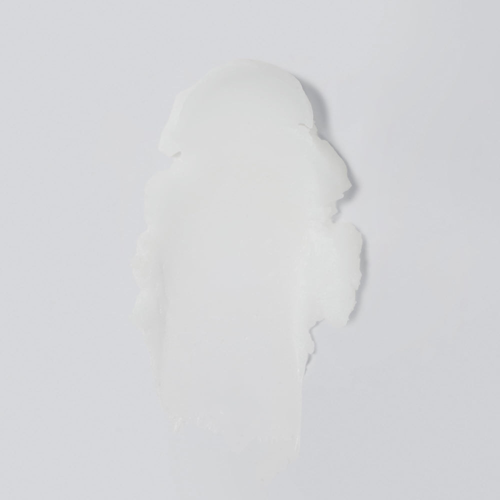 Versed Day Dissolve balm on wet hands showing makeup-melting action
