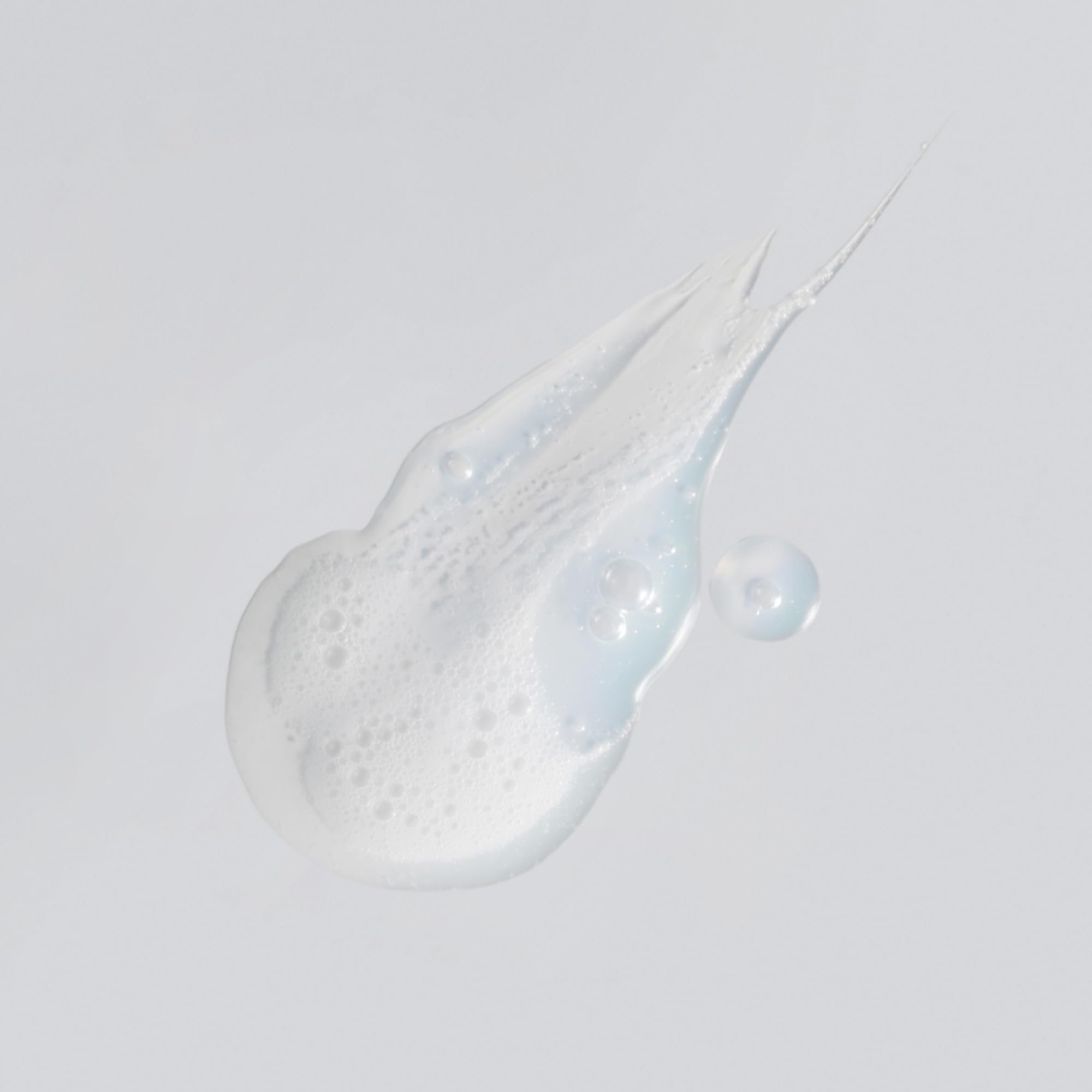 Versed Purist cleanser pump close-up delivering gentle foam for sensitive skin