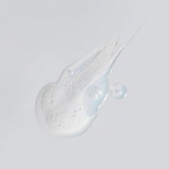 Versed Purist cleanser pump close-up delivering gentle foam for sensitive skin