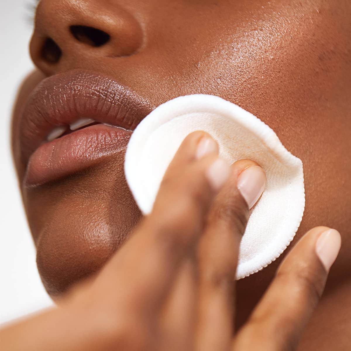 Versed Weekend Glow cotton pad swab ready for face and neck application.