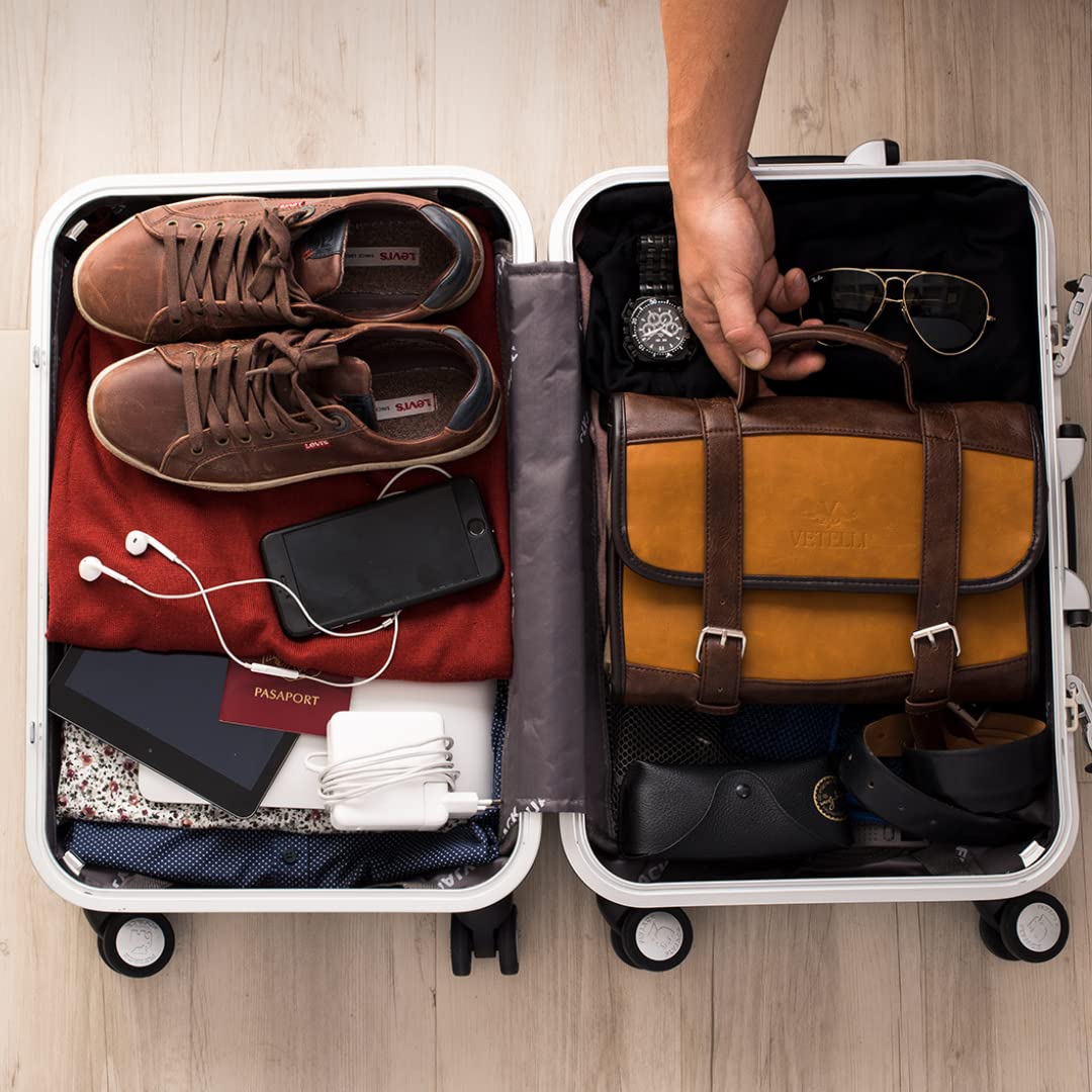 Vetelli Leather Toiletry Bag water-resistant exterior protects contents during travel.