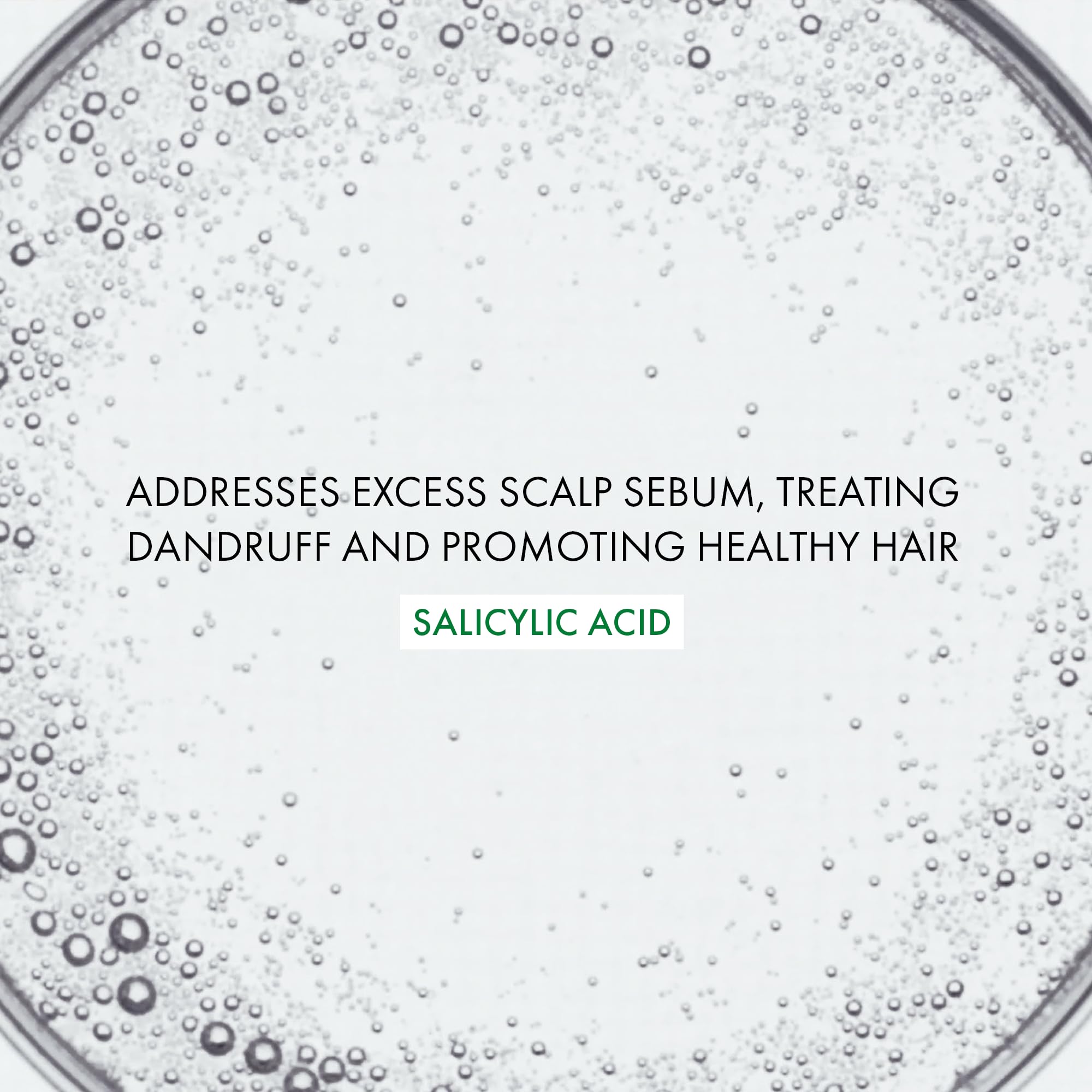 VICHY Dercos applied to scalp demonstrating targeted flake treatment